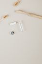 Top View Of Dental Floss And Bamboo Toothbrushes