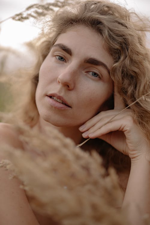 Close-Up of a Woman with Curly And Blonde Hair