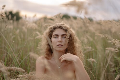 A Woman Holding a Dried Grass