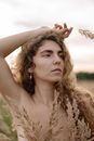 Beige Portrait of Woman with Dry Grass