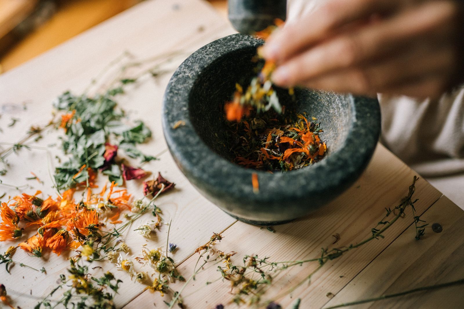 Loose-leaf teas measured at the counter