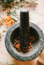 Black Mortar and Pestle on Gray Concrete Surface