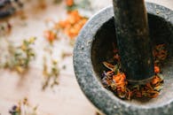 Pounding Dried Flowers with a Mortar and Pestle