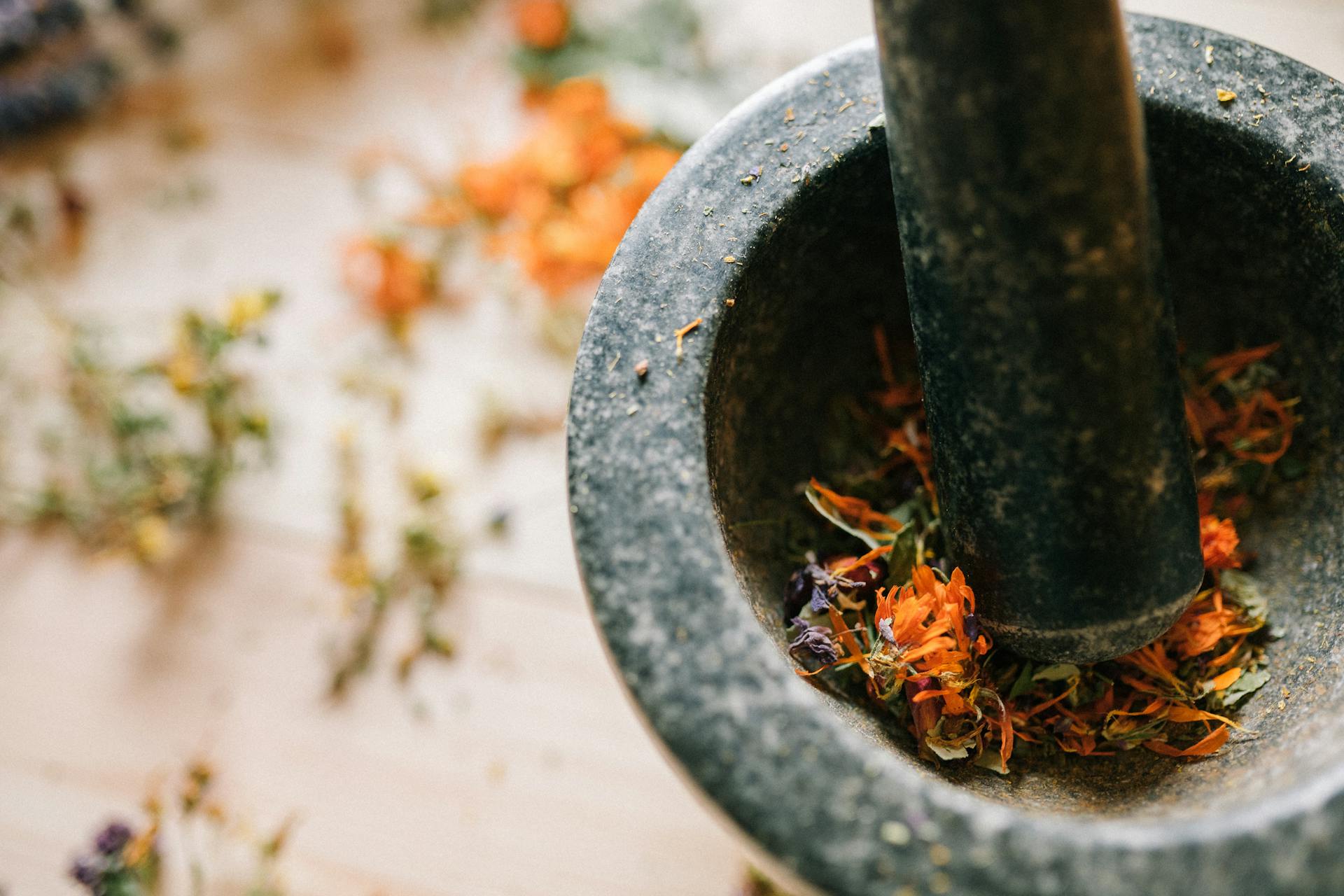 Pounding Dried Flowers with a Mortar and Pestle