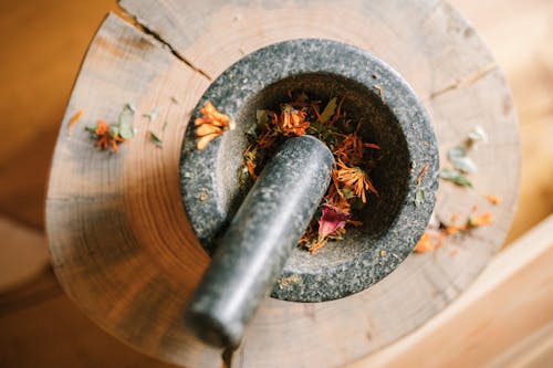 Free Black Mortar and Pestle over a Wood Stock Photo