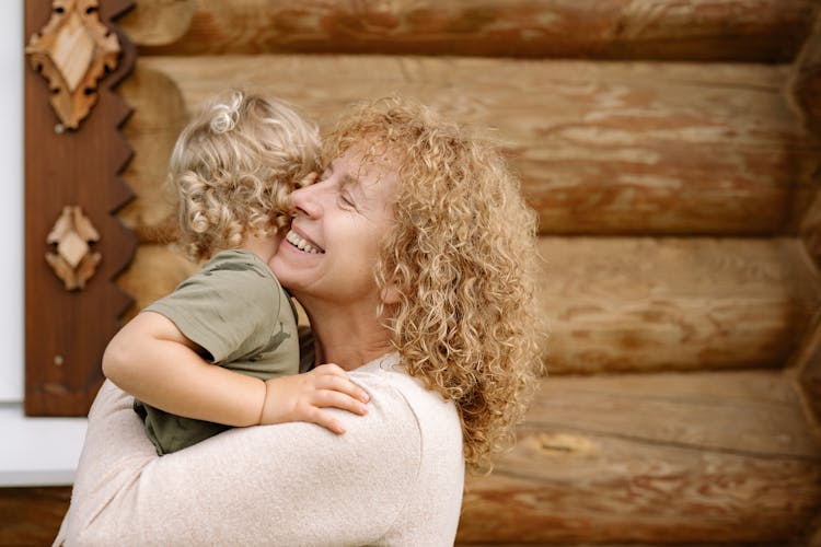 A Grandmother Carrying A Child