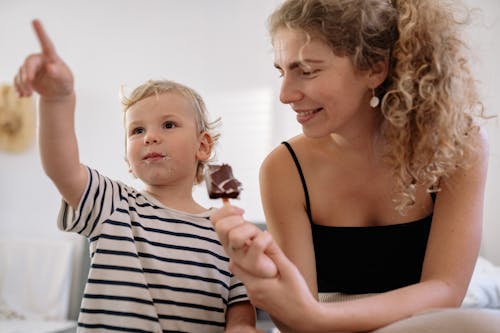 A Child Eating a Chocolate Ice Cream