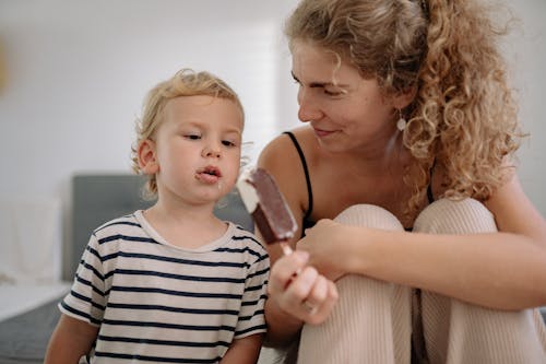 A Boy Eating a Chocolate Ice Cream