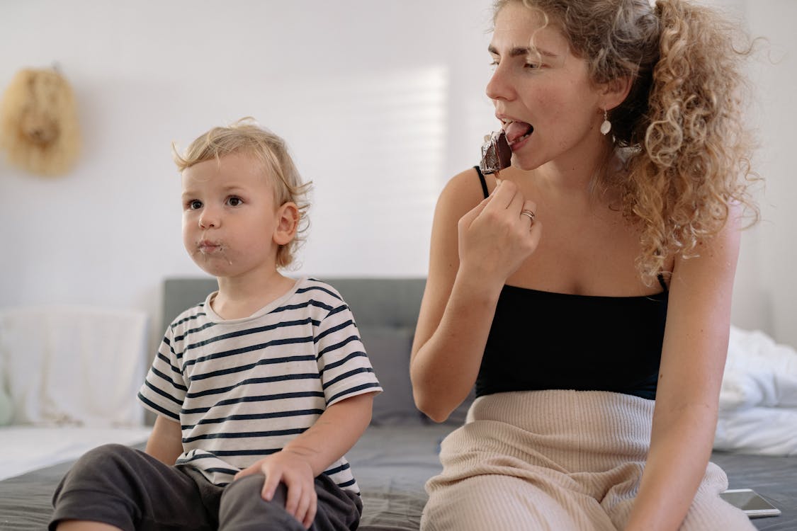 A Woman Eating a Chocolate Ice Cream