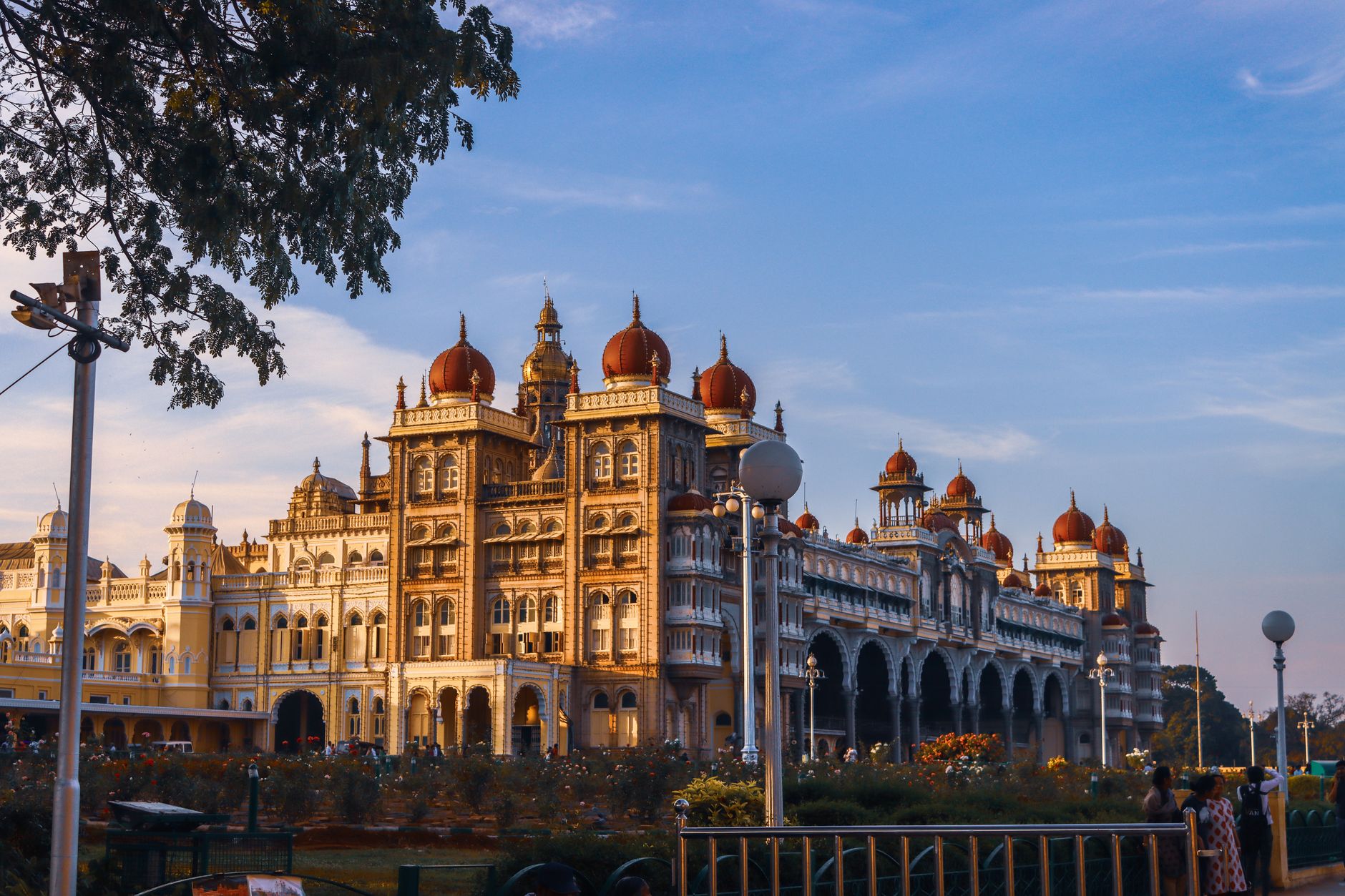 A breathtaking view of Mysore Palace, an iconic landmark in India, captured with architectural grandeur against a clear blue sky.