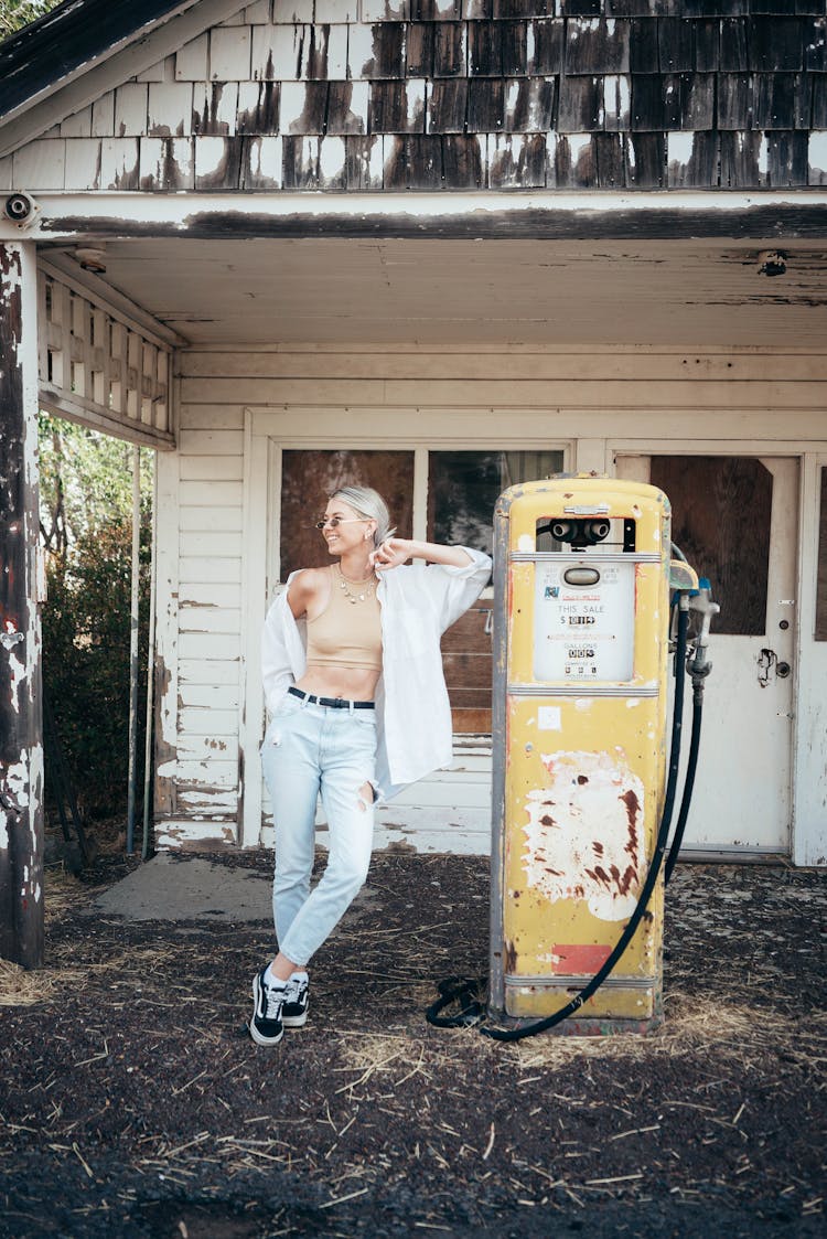 Cheerful Woman Standing Near Gas Pump