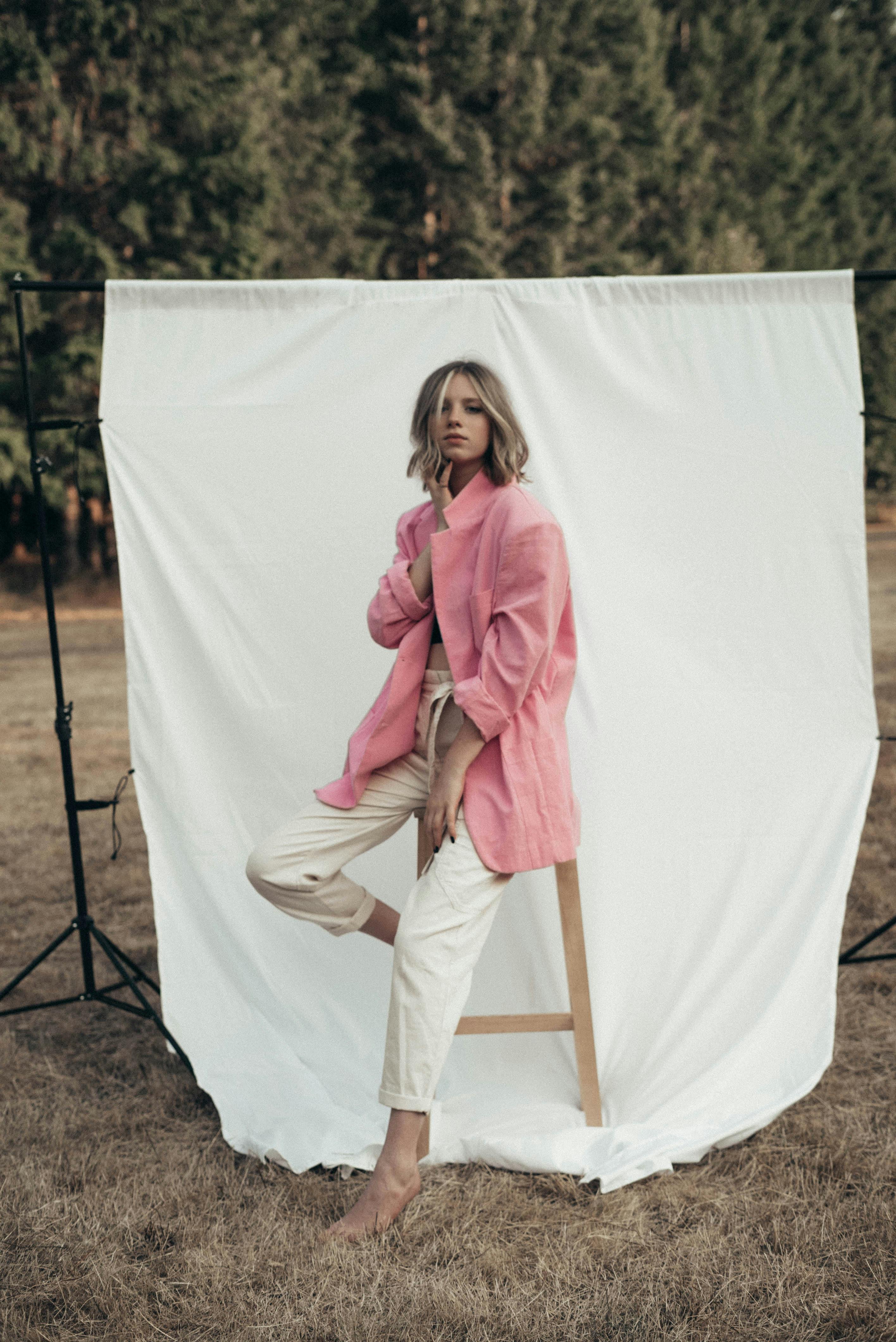 stylish woman sitting on stool