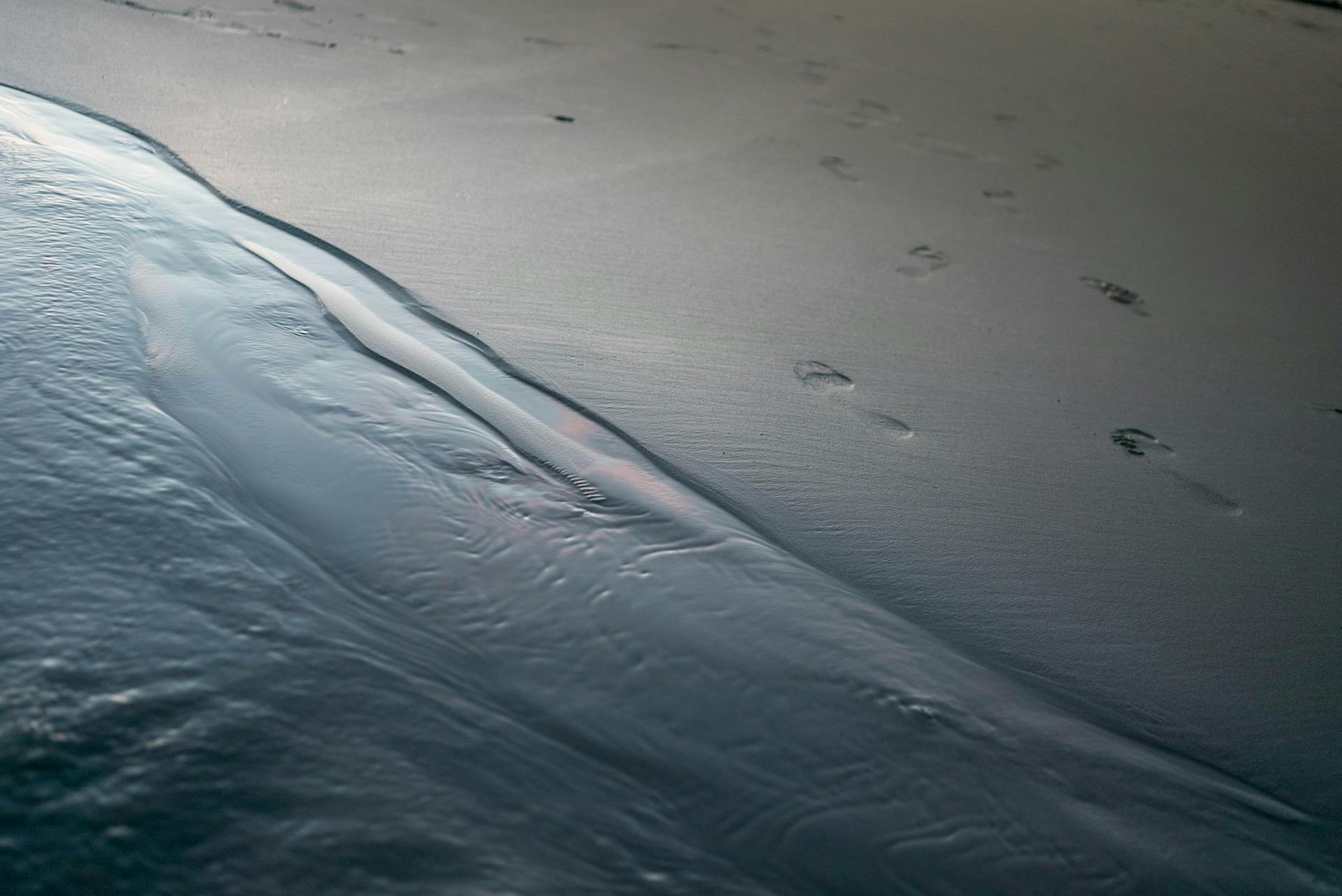 Sandy beach with traces on surface