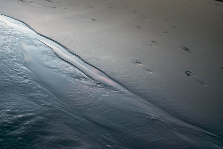 Sandy Beach With Traces On Surface