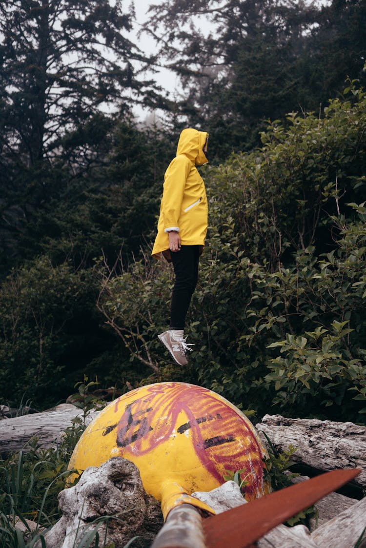 Unrecognizable Person Jumping On Metal Buoy