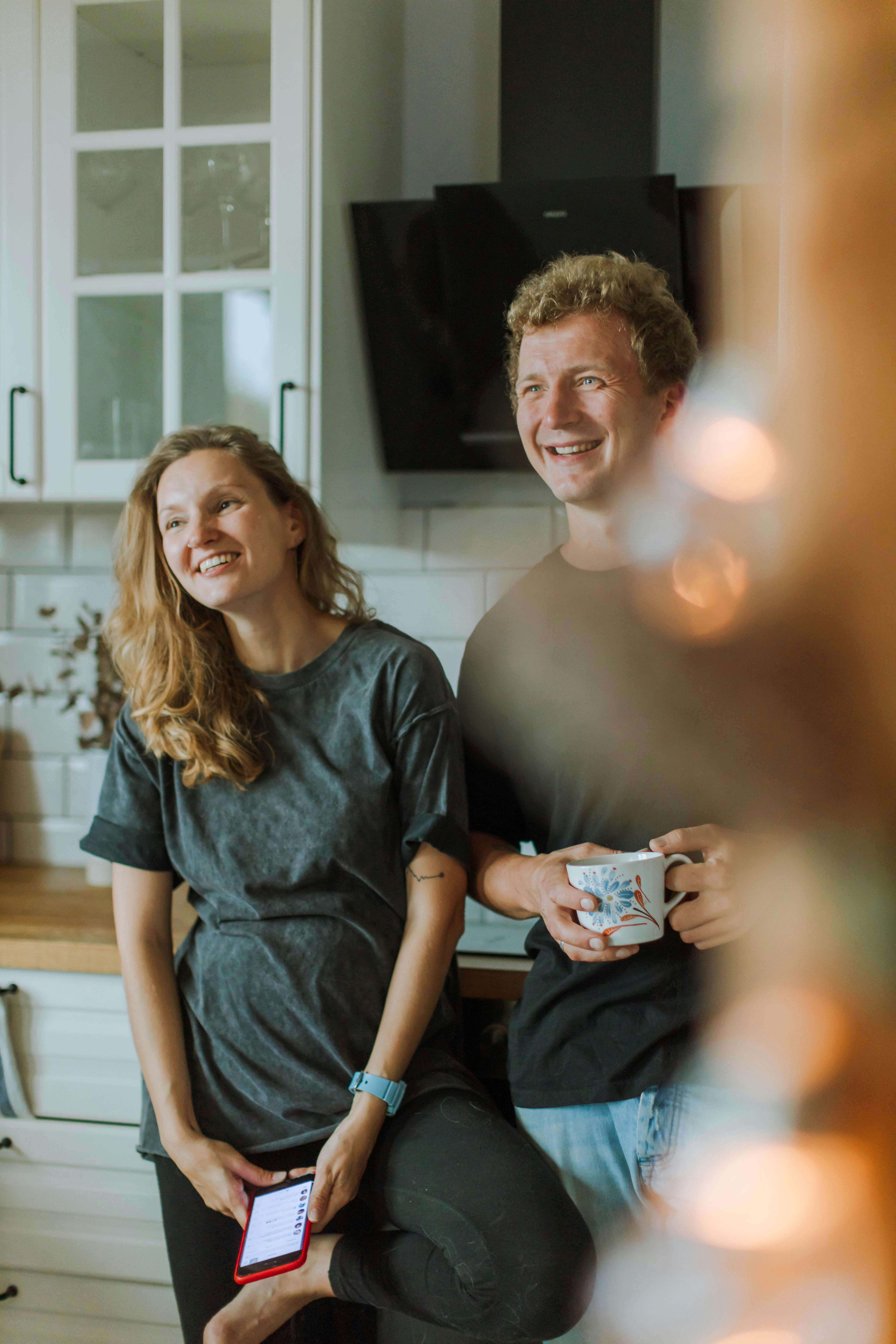 man in black crew neck t shirt and woman in gray shirt