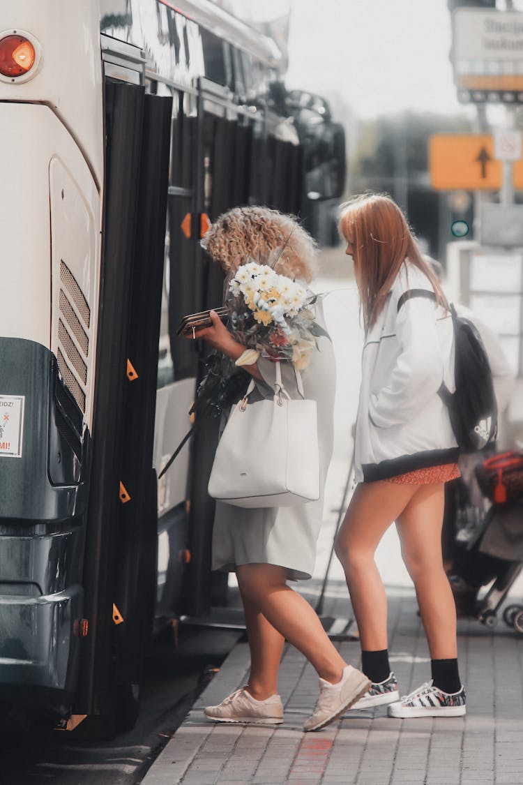 People Boarding The Bus