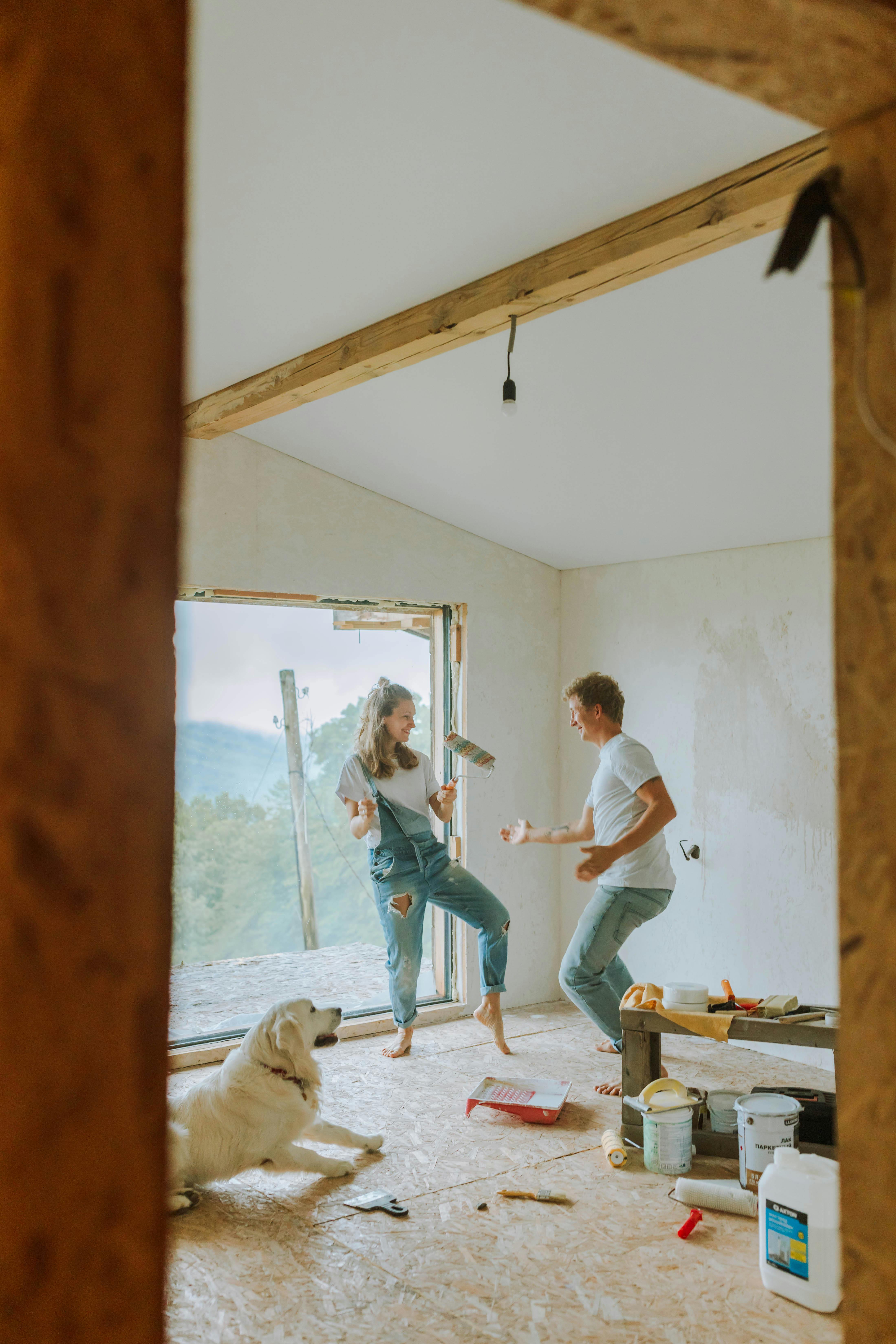 a couple painting a room