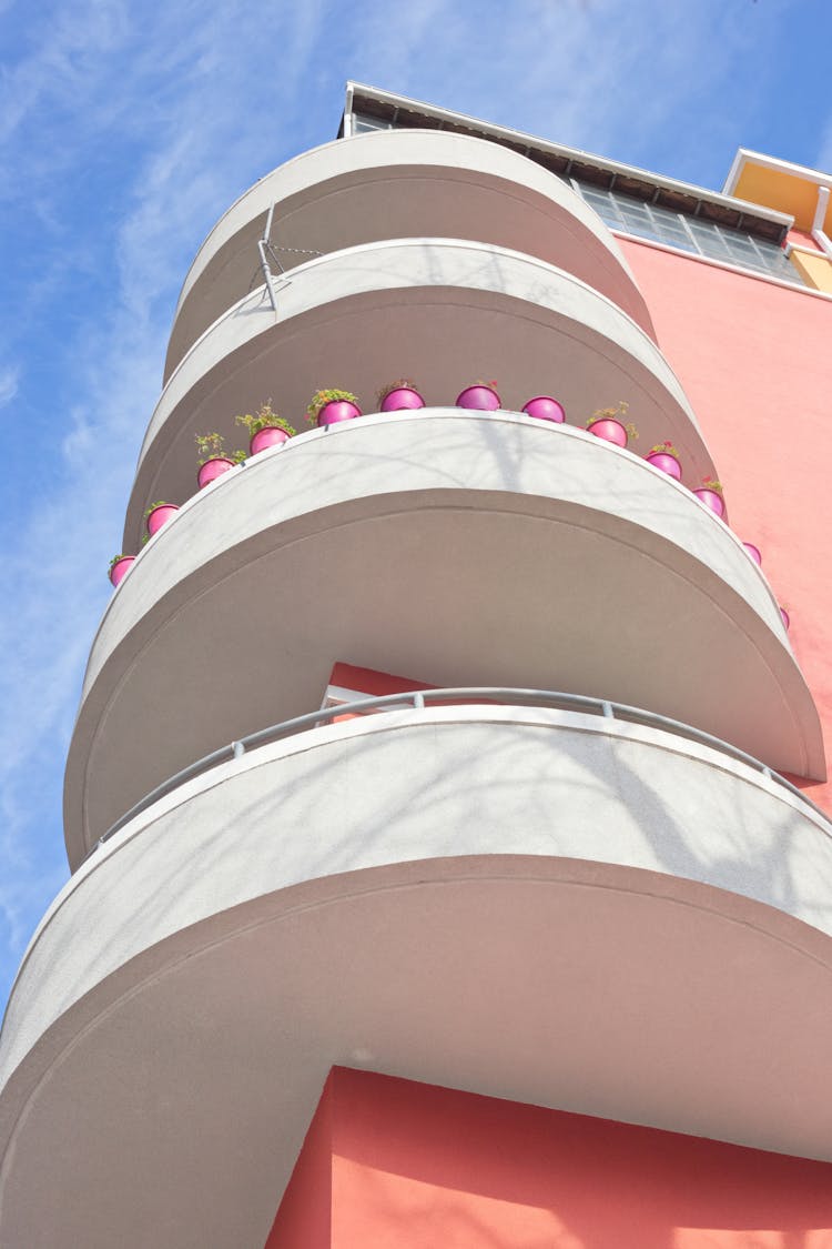 Round Balconied Of Pink Colored Building