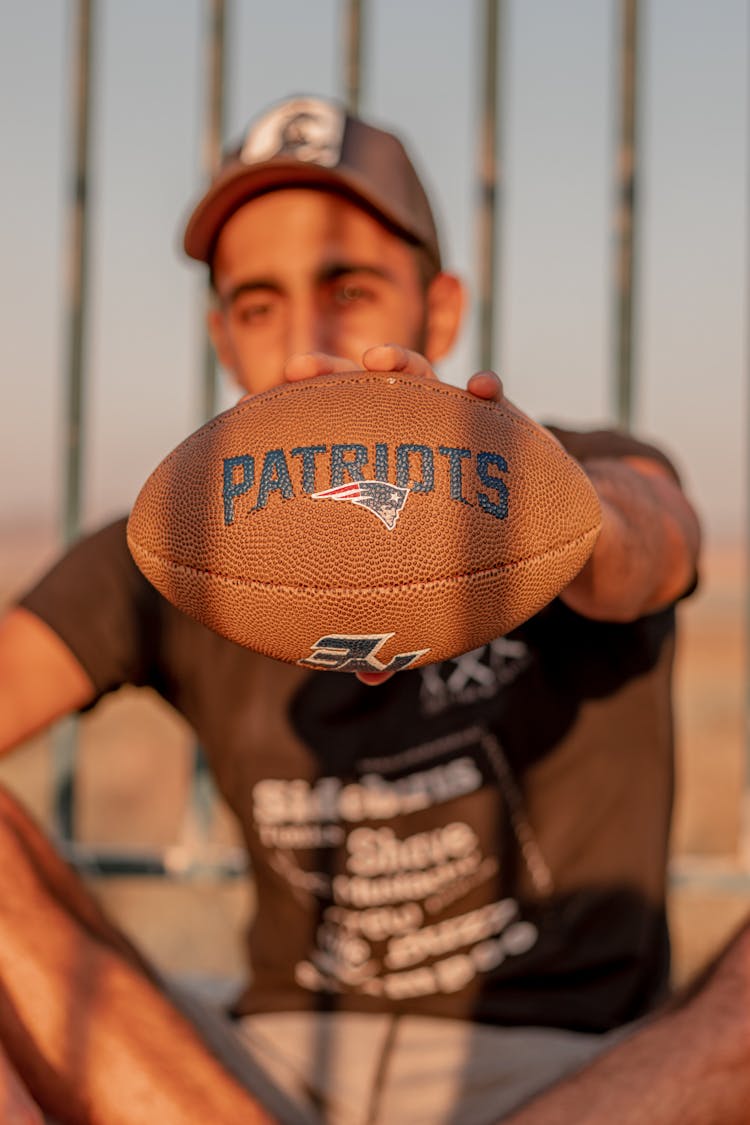 Ethnic Man Holding American Soccer Ball