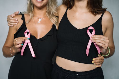 Free 2 Women Holding Pink Ribbons Stock Photo