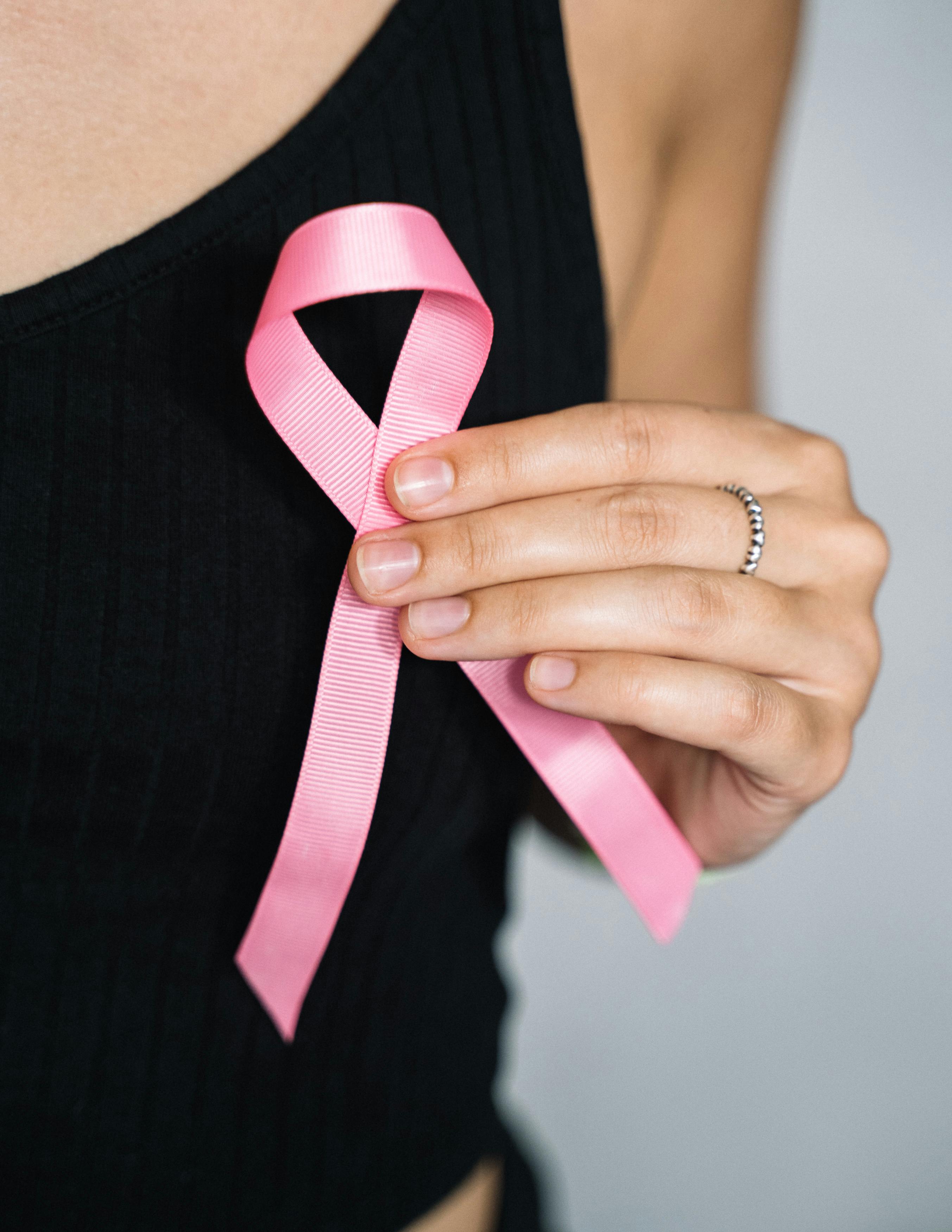 Free Woman in Black Tank Top Holding Pink Ribbon Stock Photo