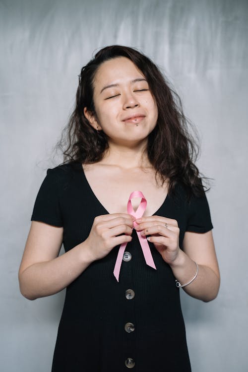 Woman Holding Pink Ribbon