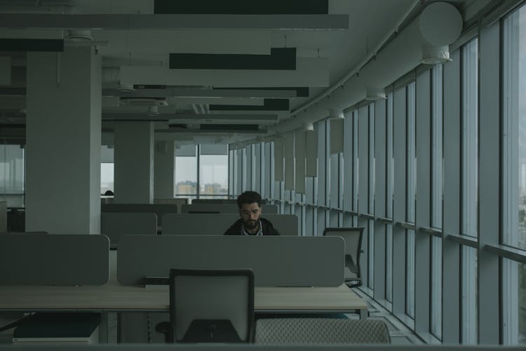 A Man Working Inside An Office