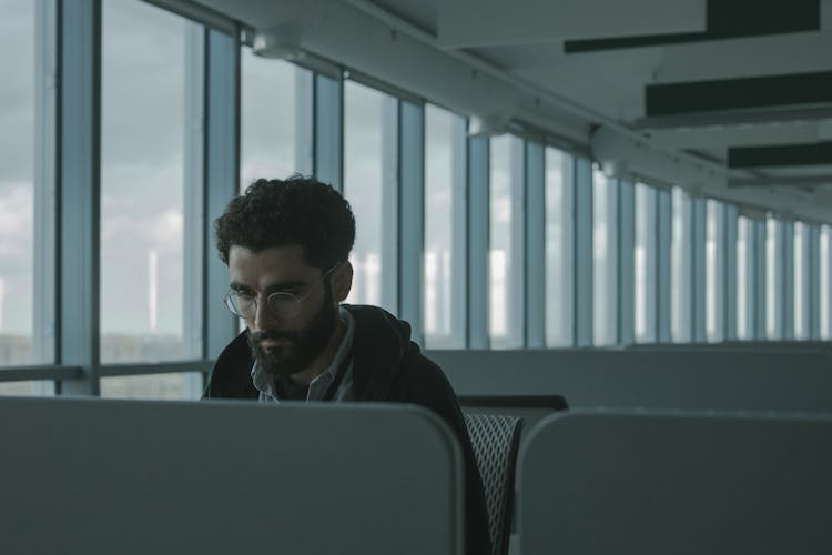 Man Sitting At An Airport Lounge 