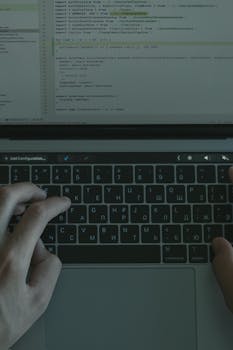 Computer engineer working on laptop