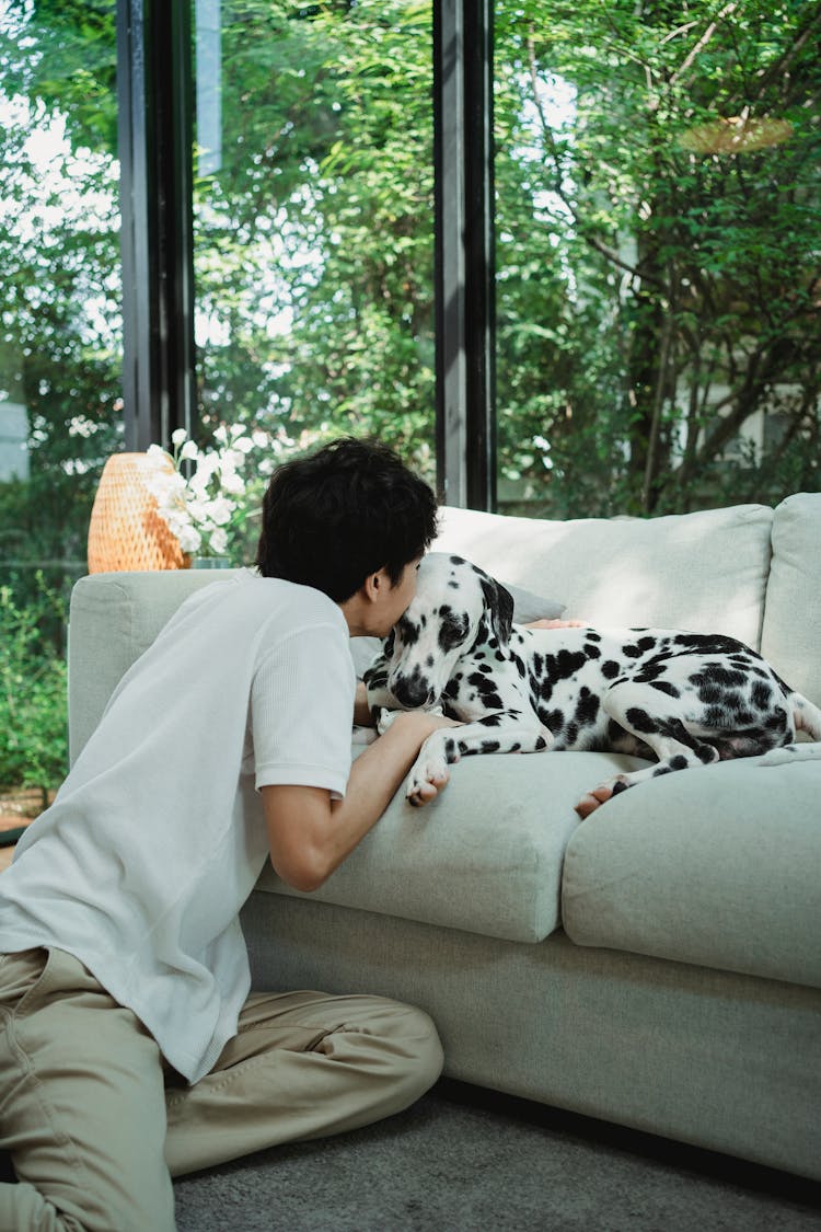 A Man Kissing His Dog