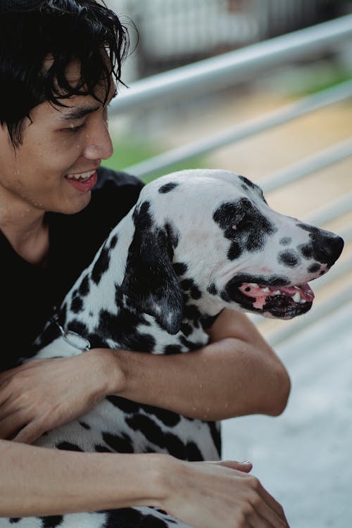 Free A Man Hugging His Dog Stock Photo