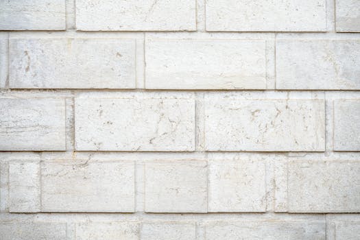A close-up view of a textured white brick wall, ideal for backgrounds.