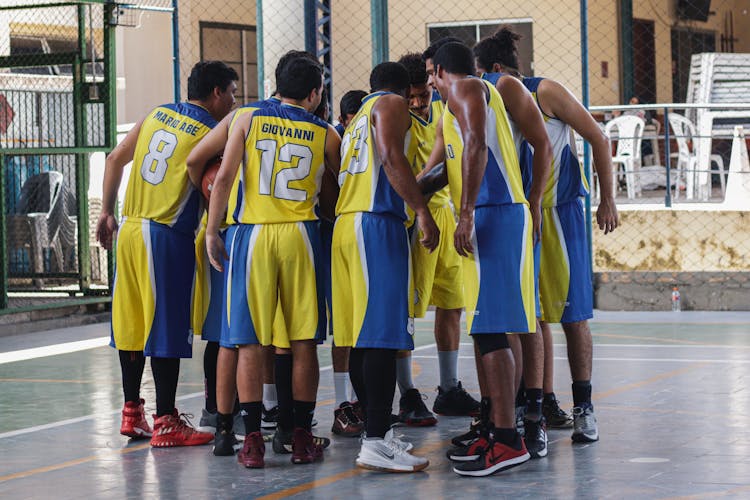 Unrecognizable Multiethnic Group Of Players On Playground