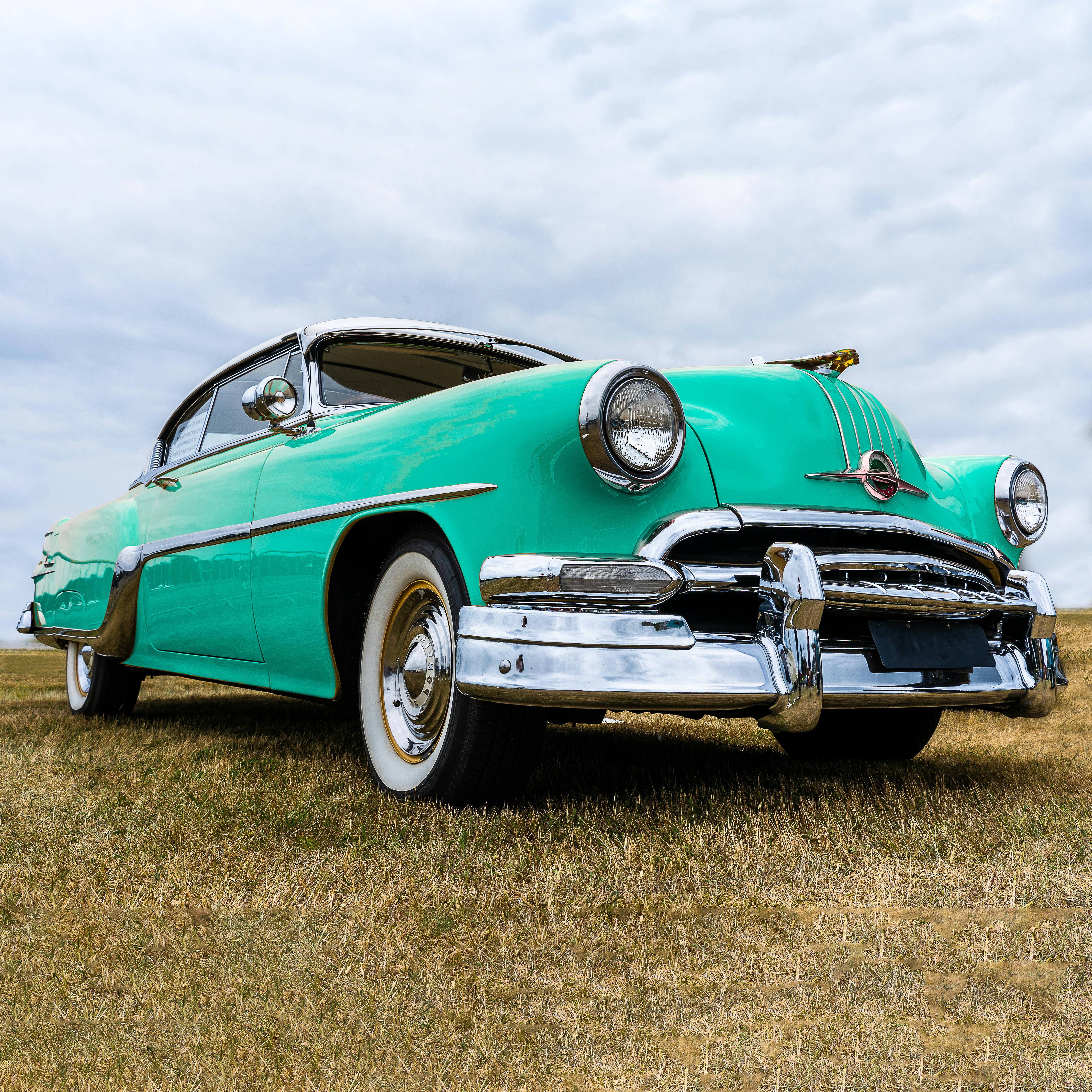 Green Classic Car on Green Grass Field · Free Stock Photo
