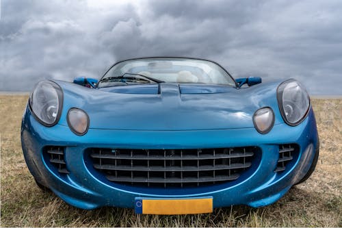 Free Blue Car Under Cloudy Sky Stock Photo