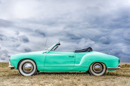 Free Green Convertible Car Under Cloudy Sky Stock Photo