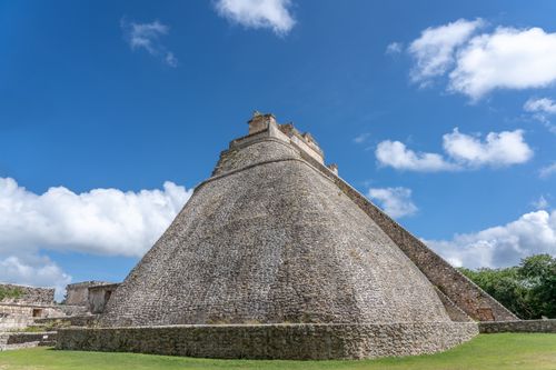 Free Explore the ancient Pyramid of the Magician at Uxmal, Mexico, under a vibrant blue sky. Stock Photo