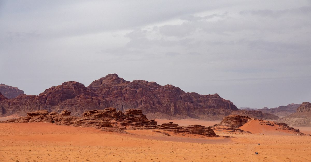 A Rock Mountains in a Desert Under Gray Sky · Free Stock Photo