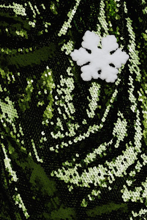 Snowflake on Green Sequin Fabric