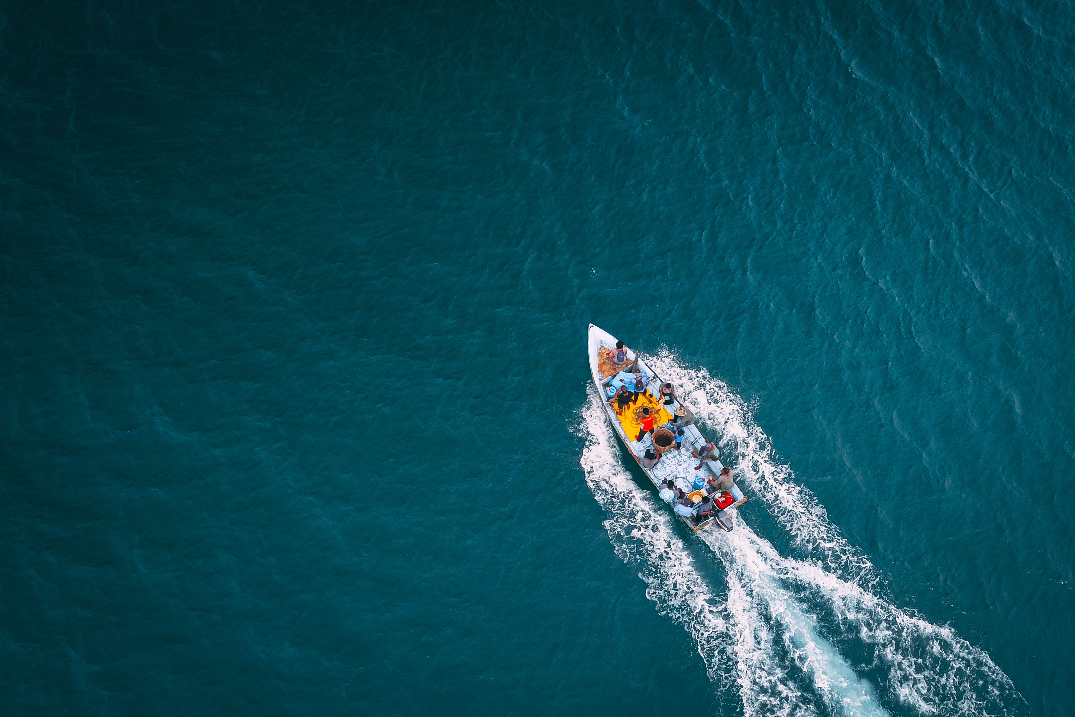 Vessel sailing in turquoise ocean