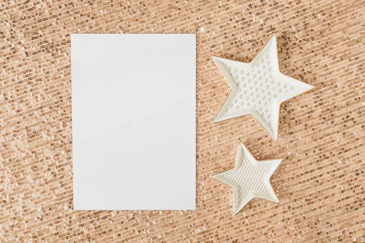 White Paper On Brown Glittery Surface