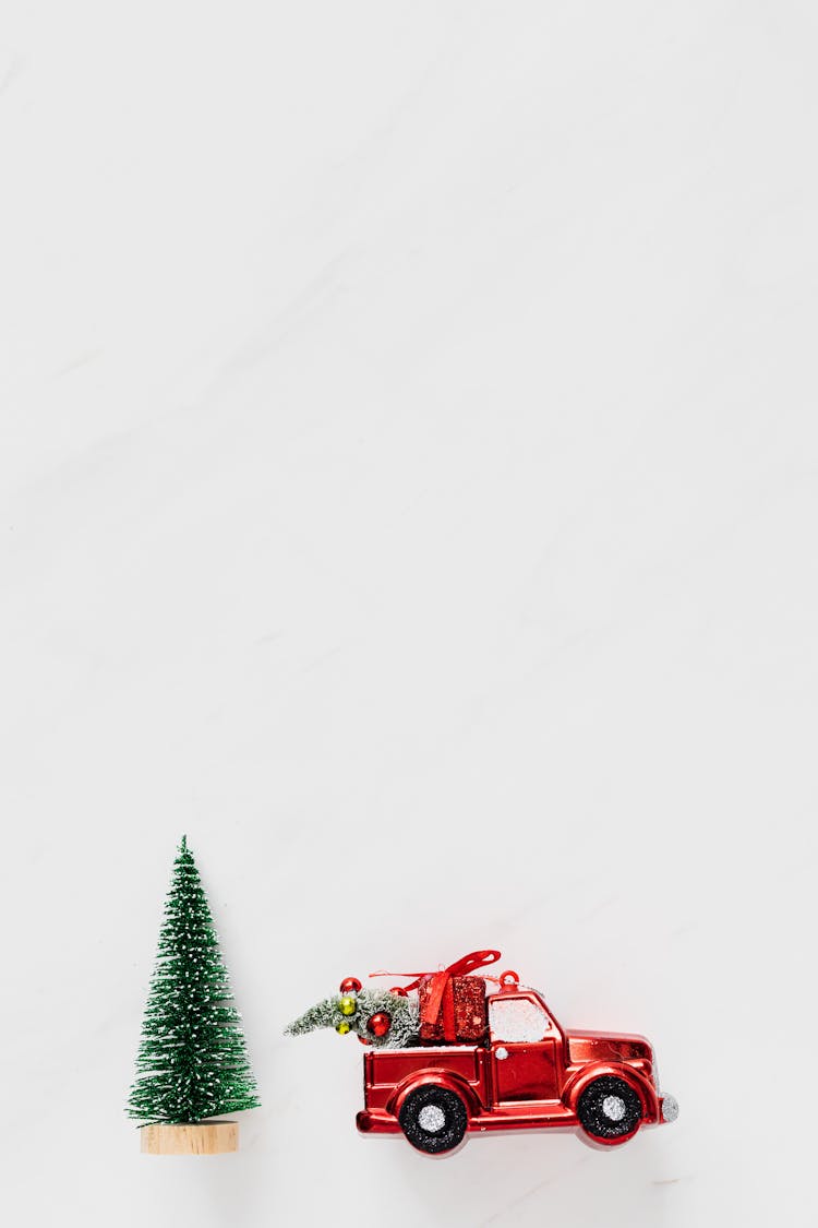 Toy Car And Christmas Tree On White Background