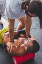 Man Assisting with Massage on a Foam Roller