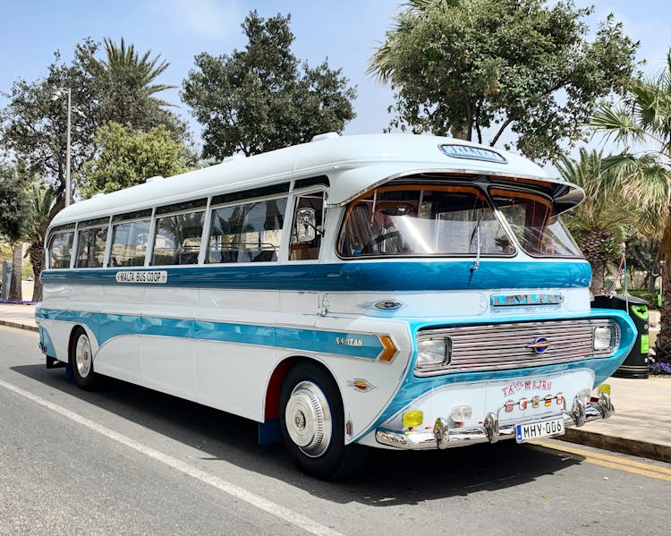 Vintage Bus Parked On Street On Sunny Day