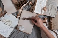 Person Holding Brown Wooden Frame