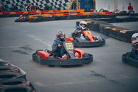 Man in Black and Red Suit Riding Go Kart