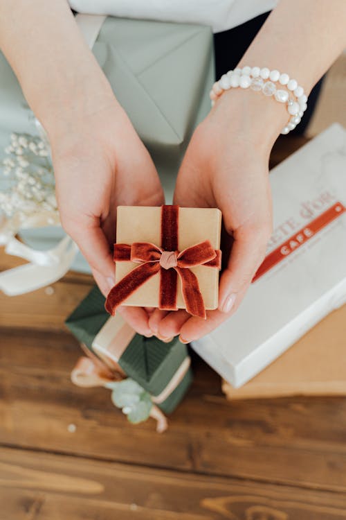 Free A Person Holding a Gift  Stock Photo