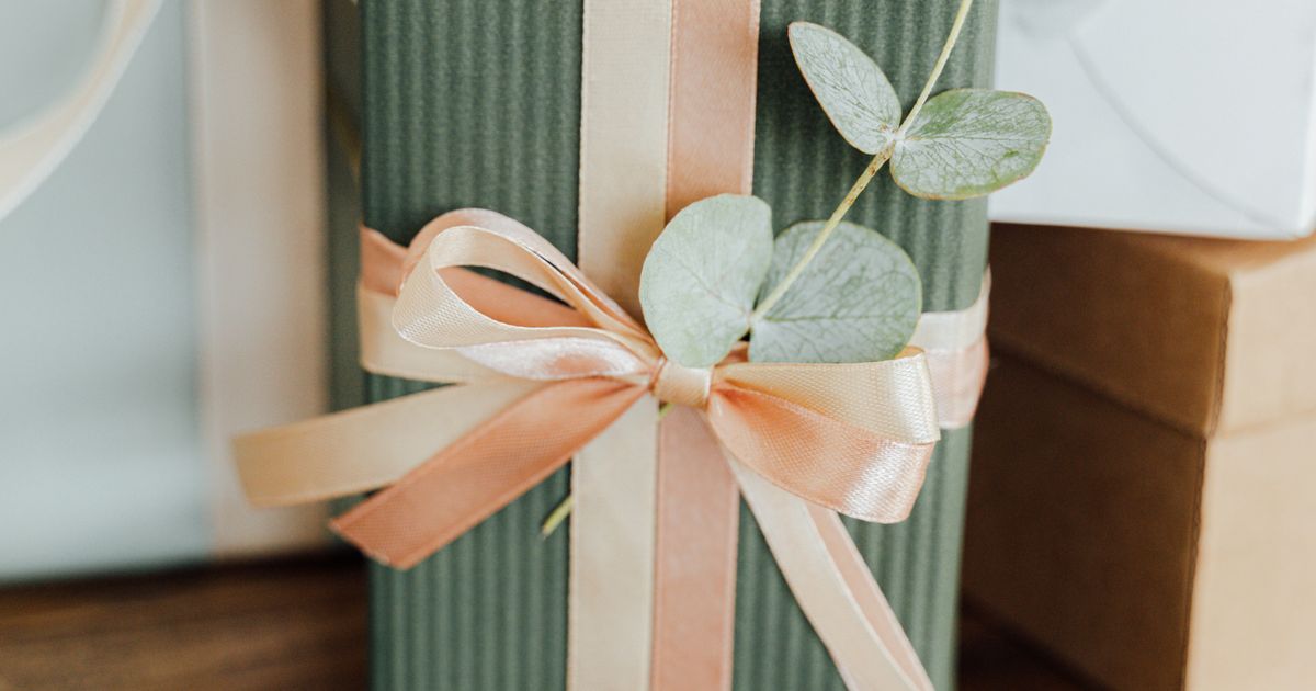 Wrapped gift with flowers on a table