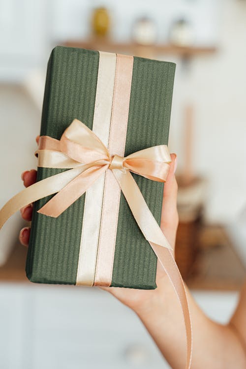 Green Gift Box With Peach Ribbon